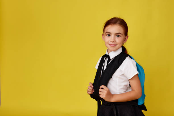 istock adorable schoolgirl with backpack. Back to school 1334491639