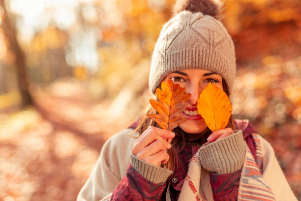istock Woman having fun outdoors on sunny autumn day 1334493016