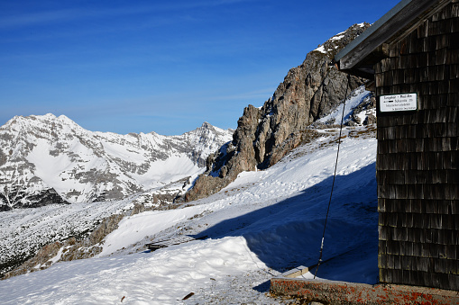 Innsbruck, Austria - January 2020; Panoramic view Nordkette mountain with mountain hut just North of the city and part of Austria's largest nature park, the Karwendel Nature Park