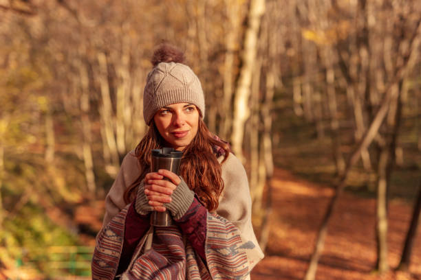 Woman drinking tea outdoors