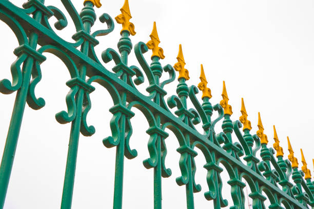 istock Old wrought iron grating yellow and green color 1334493216