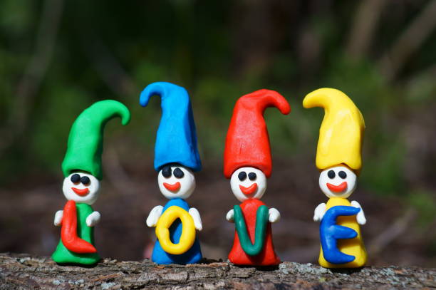 istock Figures of colorful dwarfs on a colored background. 1334493739