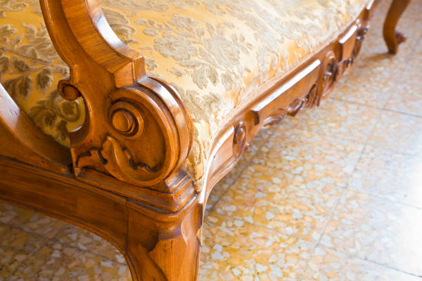Detail of an antique traditional wooden italian furniture just restored with floral decorations stock photo