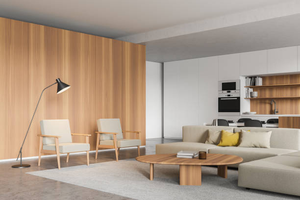 istock Corner view of living room, white kitchen with wooden elements 1334502456