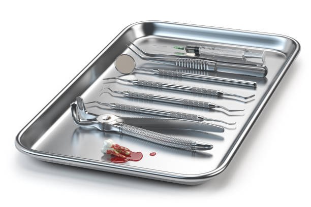 istock Dentist tools for dental care and extracted tooth with blood. 1334503619