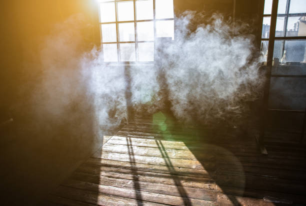 istock Sunshine window reflection on the wooden floor. Heavy smoke in loft design studio. 1334503637