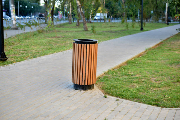 istock City park with garbage cans and flower beds 1334506353