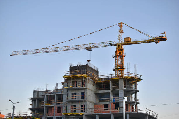 istock Construction tower crane in the city at sunset 1334506394