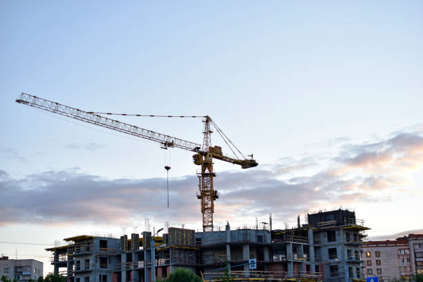 istock Construction tower crane in the city at sunset 1334506398