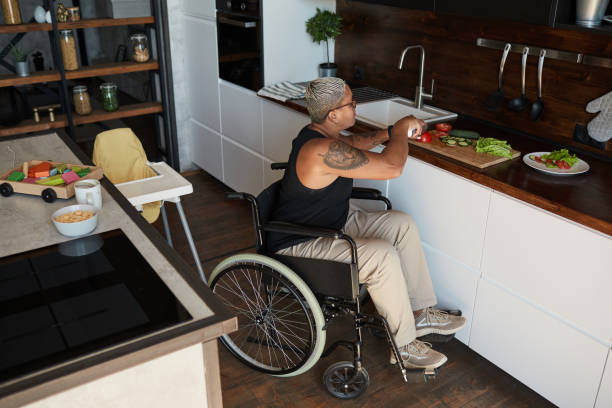 istock Woman with Disability Making Healthy Lunch 1334507503
