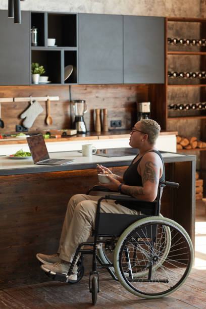 istock Young Woman with Disability at Home 1334507522