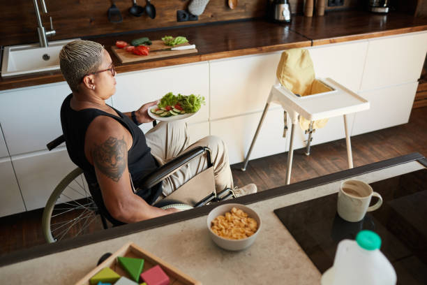 istock Woman with Disability Making Healthy Breakfast 1334507524