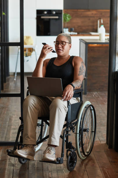 istock Woman with Disability Working from Home 1334507531