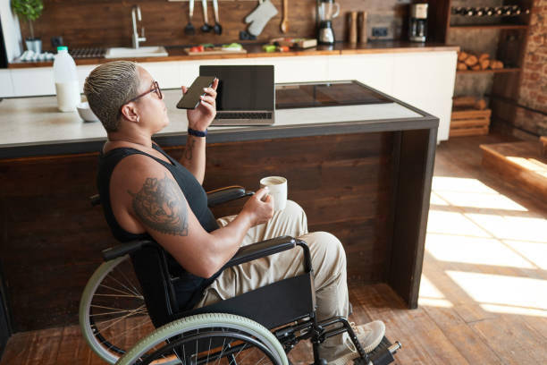 istock Modern Woman with Disability Using Smartphone 1334507544
