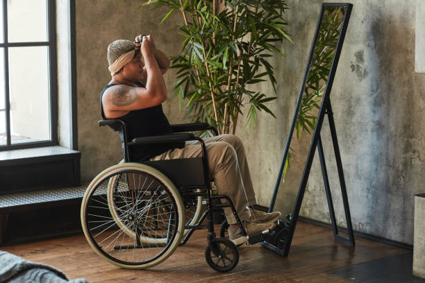 istock Person in Wheelchair Looking at Mirror 1334507558