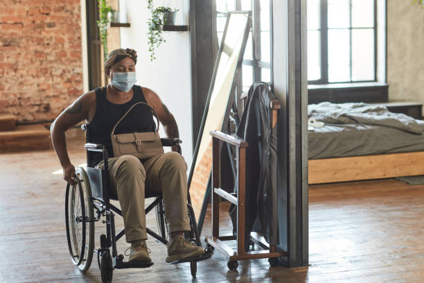 istock Woman with Disability Wearing Mask 1334507567