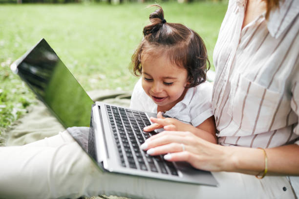 istock Young Mother Working in Park 1334508032