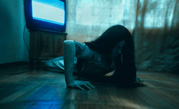 girl in image of scary zombie crawls on floor in dark room. - vengeful imagens e fotografias de stock