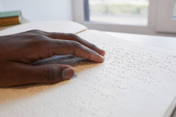blind person reading book - tillgänglighet blind braille bildbanksfoton och bilder