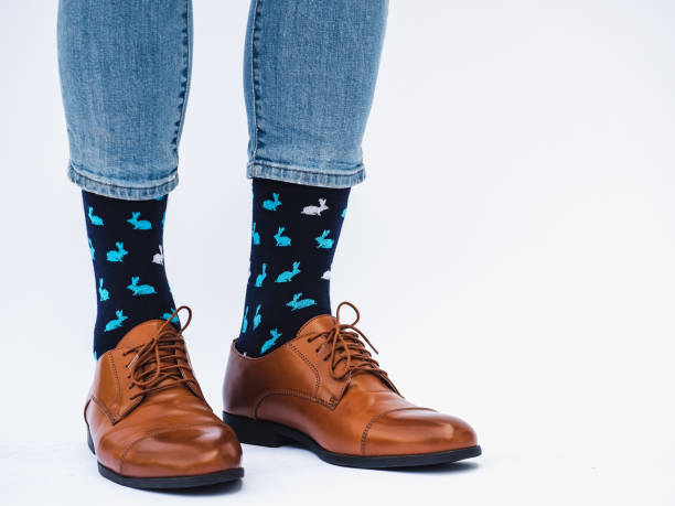 istock Men's legs, trendy shoes and bright socks 1334510177