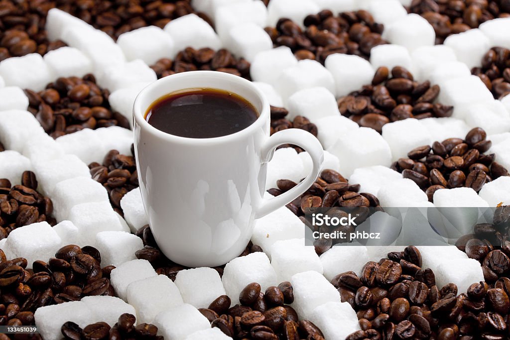 cup of coffee cup of coffee with coffee beans and sugar Abundance Stock Photo
