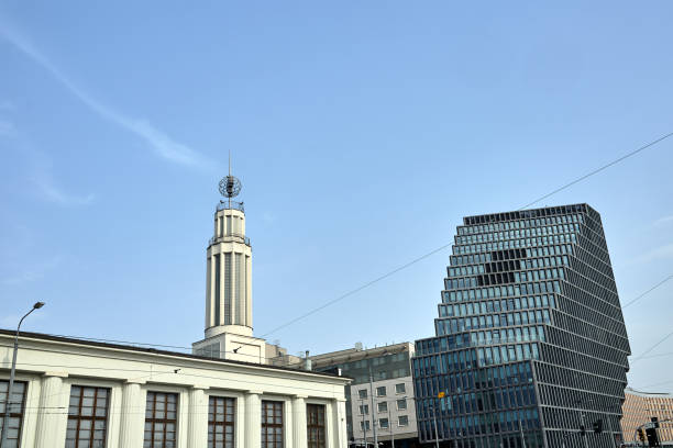 Tower of a historic building and a modern office building in Poznan