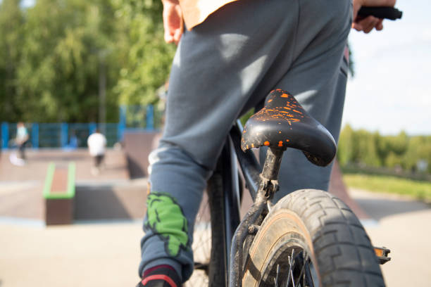 istock A boy on a bicycle on a city street. 1334513648