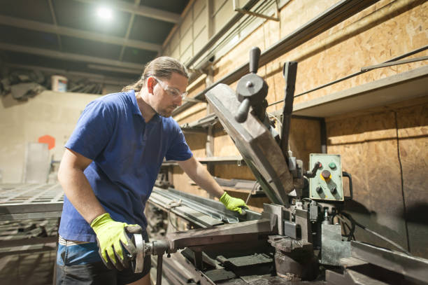 istock Worker using electric wheel grinding on steel structure in factory 1334515781