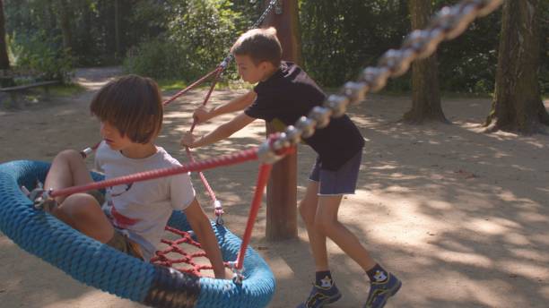 istock Children are actively playing. Boy showing noncompliant behavior problems. 1334516993