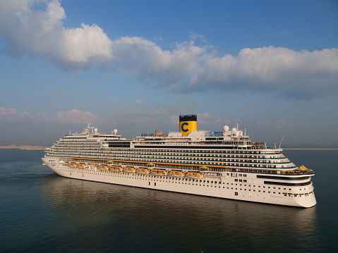Dubai, United Arab Emirates: November 30th 2019: large white cruise ship of the Costa company at a port entrance