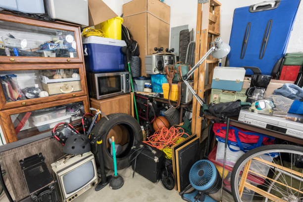 Cluttered Corner Cluttered corner full of household storage items and vintage electronics. overflowing dumpster stock pictures, royalty-free photos & images
