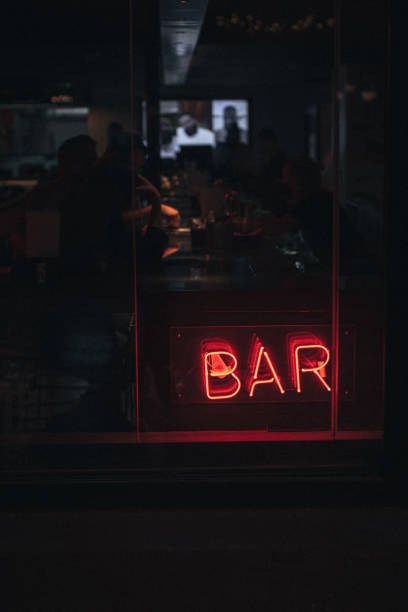 istock Red neon sign BAR on the evening window 1334519797