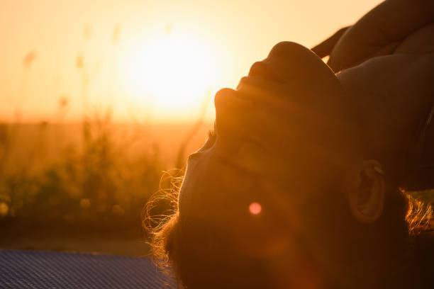 istock Female head in warm sunlight with flare 1334522668