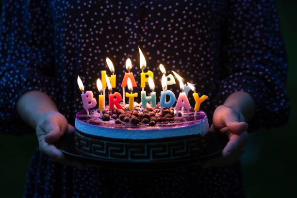 istock Birthday cake with burning candles 1334523953
