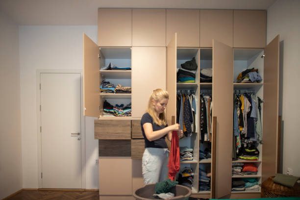 istock Woman reorganizing her wardrobe 1334523960