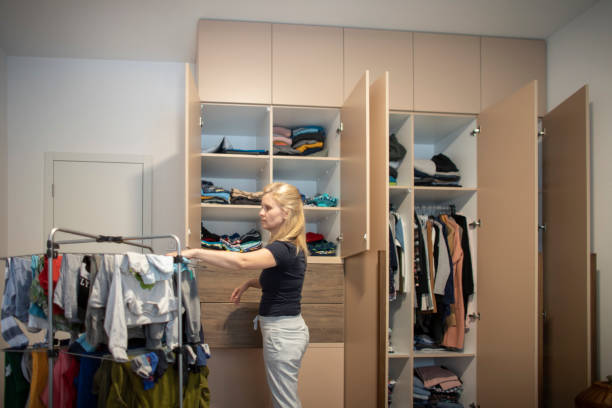 istock Woman reorganizing her wardrobe 1334523971
