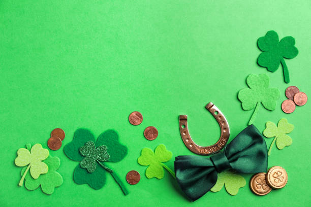 istock Flat lay composition with horseshoe on green background, space for text. St. Patrick's Day celebration 1334526626
