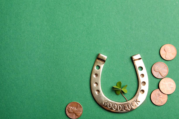 istock Flat lay composition with horseshoe on green background, space for text. St. Patrick's Day celebration 1334526636
