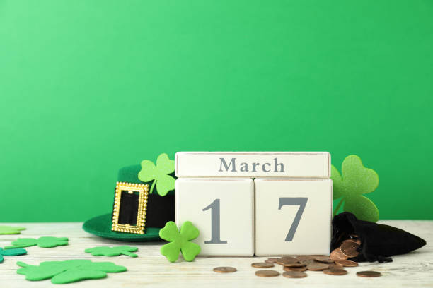 istock Composition with block calendar on white wooden table. St. Patrick's Day celebration 1334526647