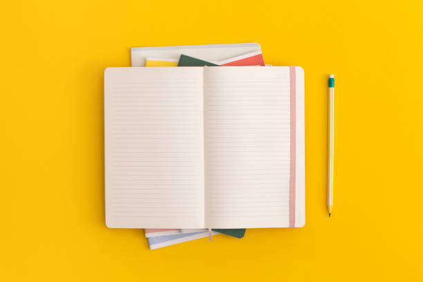 istock Notebook and pencil on yellow background. Top view. Flat lay. Back to school concept. 1334529806