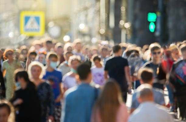 istock Blurred crowd of unrecognizable at the street 1334530862