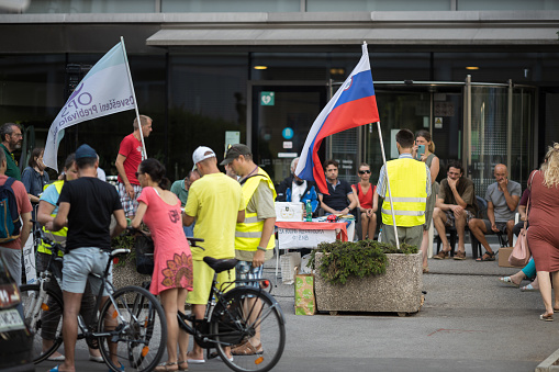 Ljubljana, Slovenia - July 12, 2021: OPS movement collecting Slovenian people signatures against the ZNB new law in front of the national TV house RTV SLOVENIJA - They collected more than enough signatures to start a referendum.