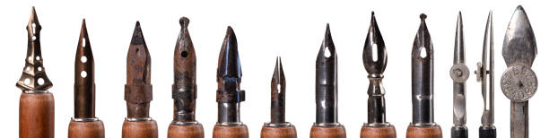 Old nibs for ink writing and ink drawing. Writing accessories covered with rust and dust. Isolated background. Old nibs for ink writing and ink drawing. Writing accessories covered with rust and dust. Isolated background. nib stock pictures, royalty-free photos & images
