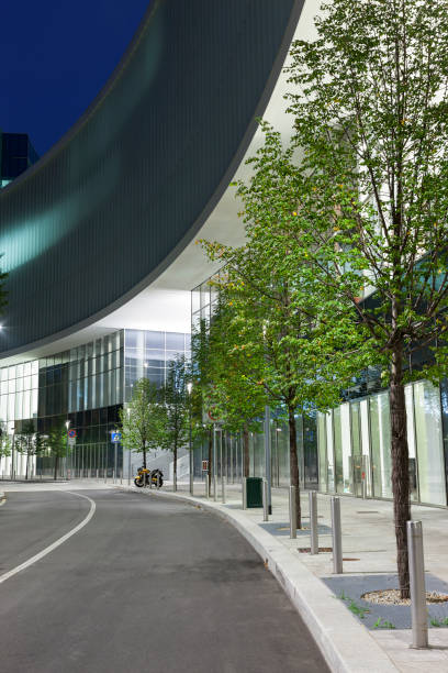 istock Modern Corporate Building and Tree Lined Street at Night 1334534058