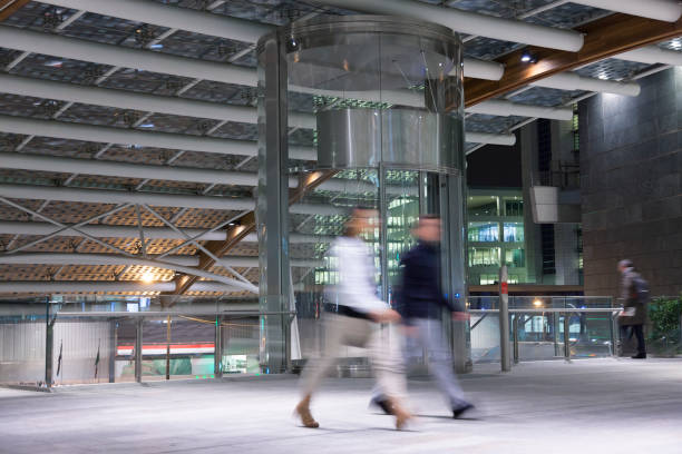 istock Blurred Business People Walking Through Modern Financial District 1334534130