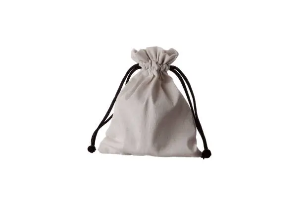 Small fabric pouch with a drawstring for tying. Isolate on a white background.