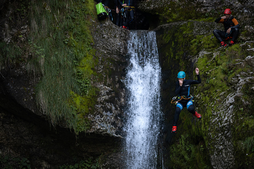 Bohinjska Bistrica, Gorenjska, Slovenia -August 14, 2021: Recreational tourist attraction of canyoneering at Grmecica waterfall in Bohinj valley