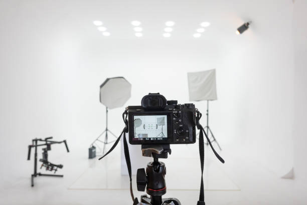 photo studio setup with lights and camera. - tripod camera photographic equipment photography imagens e fotografias de stock