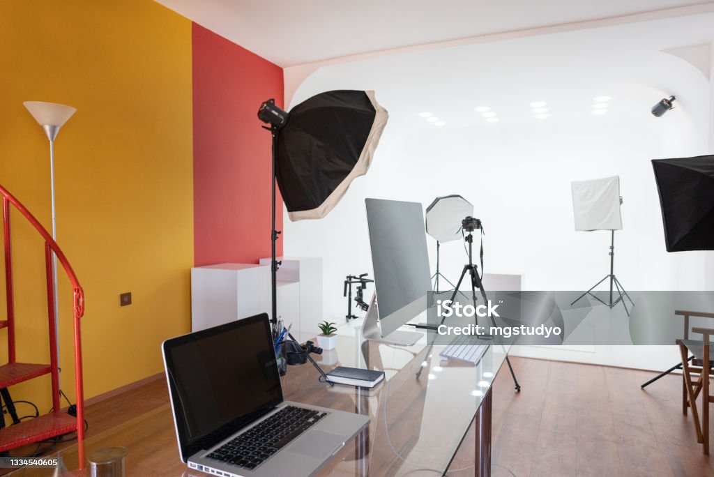 Modern Empty photo studio with photography lighting and computer. Photo Shoot Stock Photo