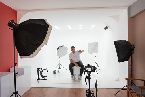 Male model standing in front of the camera at the photo studio